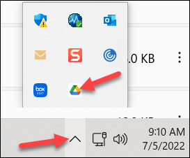 Red arrow to up caret in taskbar and Google Drive icon